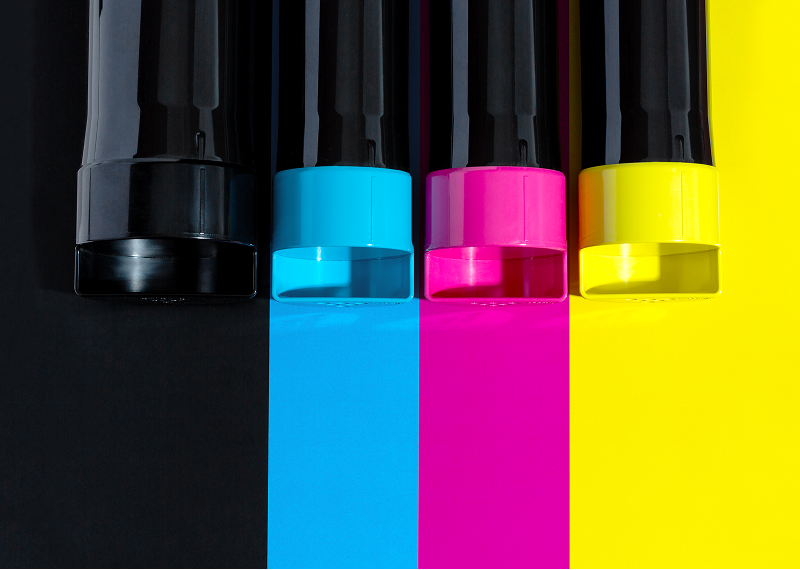 Printer ink cartridges on colored backgrounds